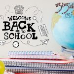 Composite of welcome back to school text with notebooks globe and apple